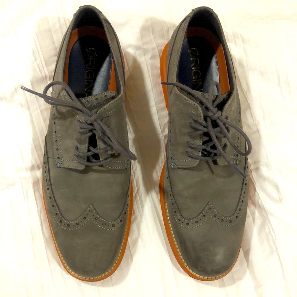 Men’s gray dress shoes with orange bottoms